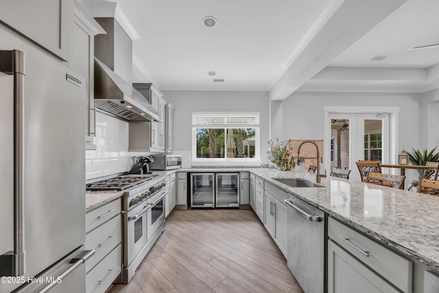 1961 Indigo Cove Way, Calabash, NC 28467 - kitchen with stainless steel appliances, a sink, wine cooler, and backsplash