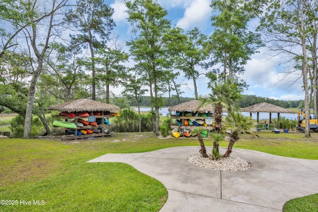1961 Indigo Cove Way, Calabash, NC 28467 - view of grassy yard with a gazebo, curved driveway, and a water view