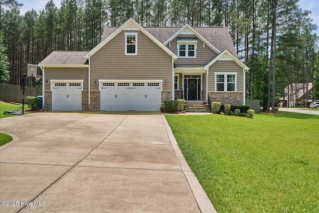 145 Cabin Branch Dr, Carthage, NC 28327 - craftsman inspired home featuring stone siding, driveway, a shingled roof, and a garage