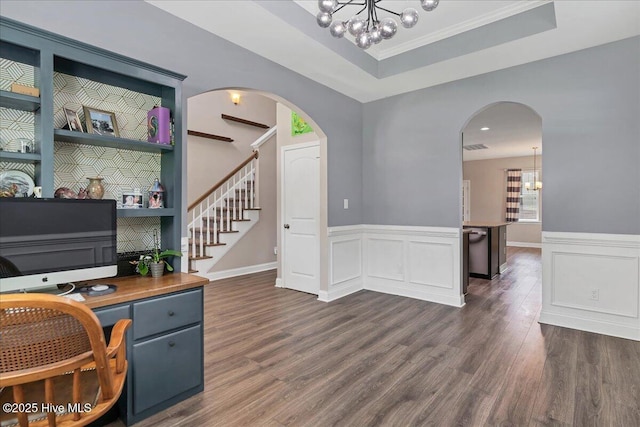 145 Cabin Branch Dr, Carthage, NC 28327 - office area featuring a chandelier, dark wood-style flooring, a wainscoted wall, a tray ceiling, and arched walkways