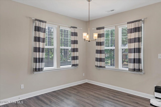 145 Cabin Branch Dr, Carthage, NC 28327 - unfurnished dining area featuring baseboards, dark wood-style flooring, and a chandelier