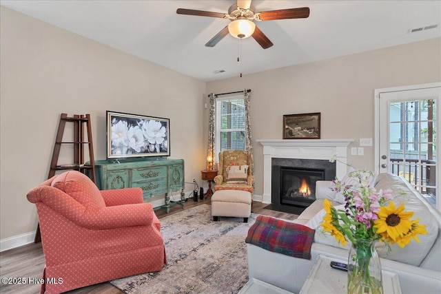 145 Cabin Branch Dr, Carthage, NC 28327 - living area featuring wood finished floors, a premium fireplace, ceiling fan, and baseboards