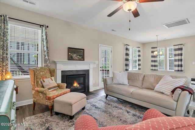 145 Cabin Branch Dr, Carthage, NC 28327 - living room featuring wood finished floors, a ceiling fan, baseboards, and a fireplace with flush hearth