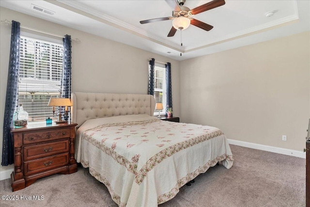 145 Cabin Branch Dr, Carthage, NC 28327 - bedroom featuring a tray ceiling, light carpet, crown molding, baseboards, and a ceiling fan
