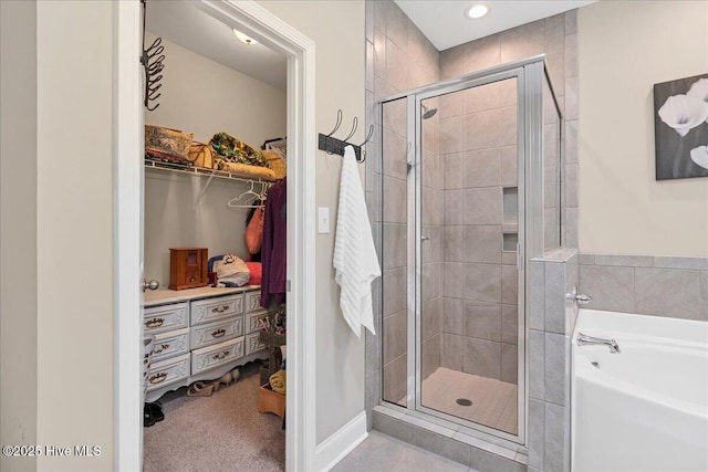145 Cabin Branch Dr, Carthage, NC 28327 - full bathroom with a stall shower, a garden tub, a spacious closet, and recessed lighting