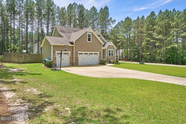 145 Cabin Branch Dr, Carthage, NC 28327 - craftsman-style house with a garage, driveway, and stone siding