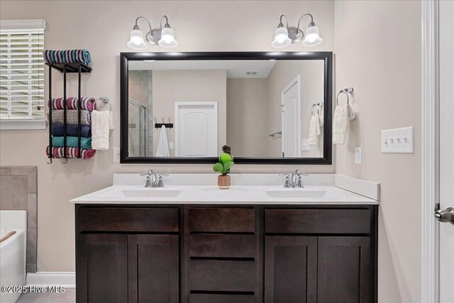 145 Cabin Branch Dr, Carthage, NC 28327 - bathroom with a garden tub, double vanity, a shower, and a chandelier