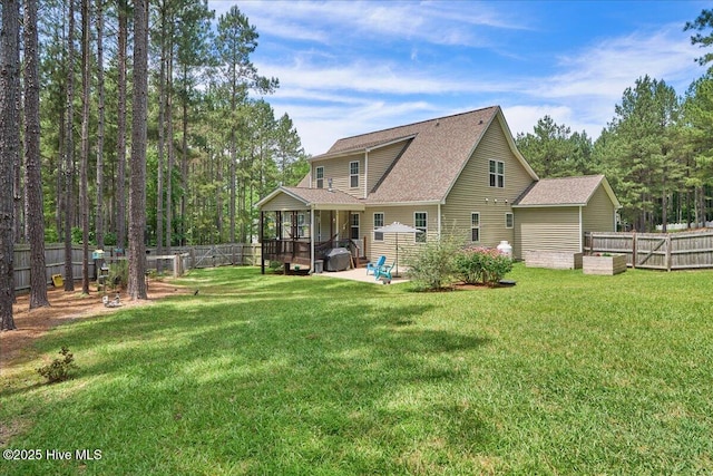 145 Cabin Branch Dr, Carthage, NC 28327 - back of house with a shingled roof and a patio area