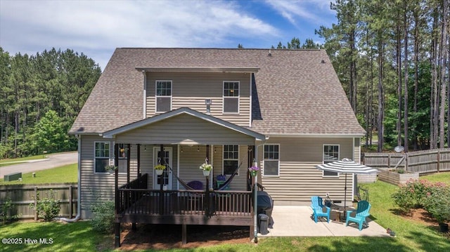 145 Cabin Branch Dr, Carthage, NC 28327 - rear view of house featuring a patio and a shingled roof