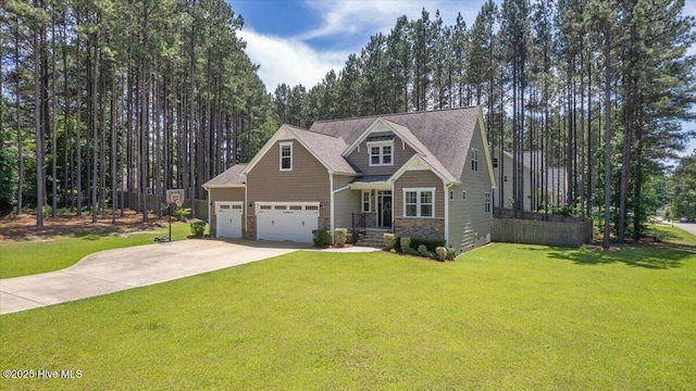 145 Cabin Branch Dr, Carthage, NC 28327 - craftsman-style house with concrete driveway, a front yard, stone siding, and an attached garage