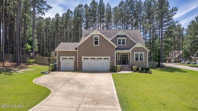 145 Cabin Branch Dr, Carthage, NC 28327 - craftsman-style house featuring driveway, stone siding, and an attached garage