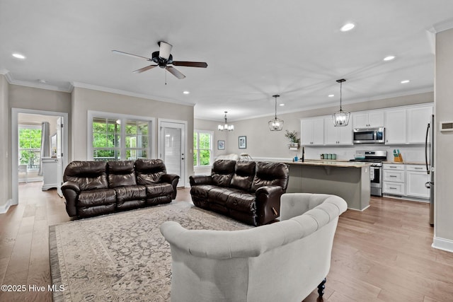 125 Steeplechase Way, Southern Pines, NC 28387 - living area with healthy amount of natural light, ceiling fan, light wood-type flooring, recessed lighting, and ornamental molding
