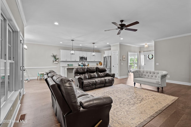 125 Steeplechase Way, Southern Pines, NC 28387 - living area featuring a ceiling fan, recessed lighting, wood finished floors, baseboards, and ornamental molding