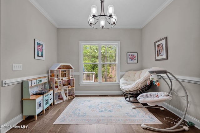 125 Steeplechase Way, Southern Pines, NC 28387 - living area featuring a chandelier, baseboards, crown molding, and wood finished floors