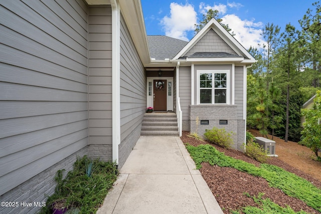 125 Steeplechase Way, Southern Pines, NC 28387 - view of exterior entry with crawl space and a shingled roof