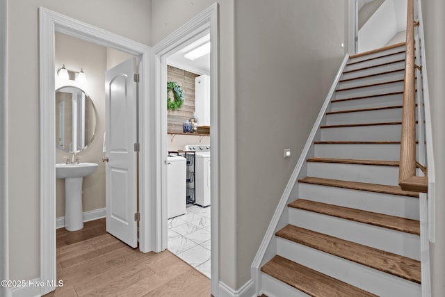 125 Steeplechase Way, Southern Pines, NC 28387 - stairs with independent washer and dryer, wood finished floors, and baseboards