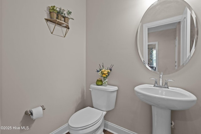 125 Steeplechase Way, Southern Pines, NC 28387 - bathroom featuring baseboards, toilet, and a sink