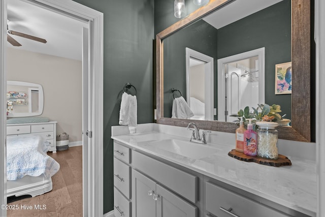 125 Steeplechase Way, Southern Pines, NC 28387 - bathroom featuring ceiling fan, vanity, baseboards, and wood finished floors