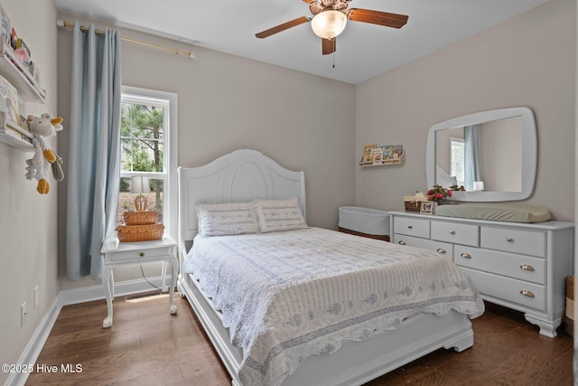 125 Steeplechase Way, Southern Pines, NC 28387 - bedroom with dark wood-style floors, ceiling fan, and baseboards