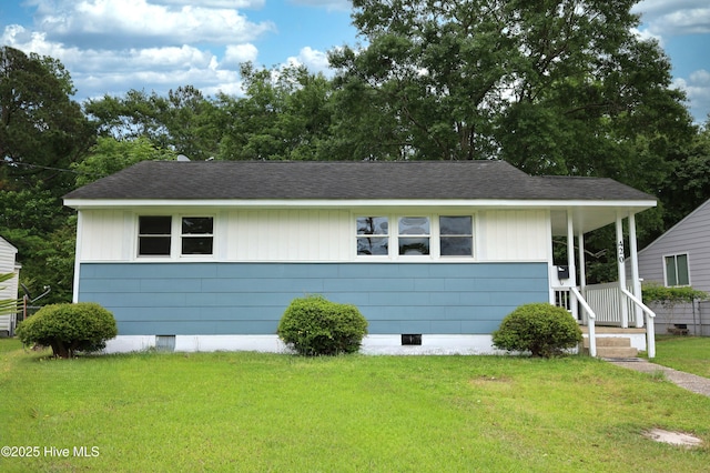 420 New River Dr, Jacksonville, NC 28540 - view of front facade featuring a front yard, roof with shingles, and crawl space