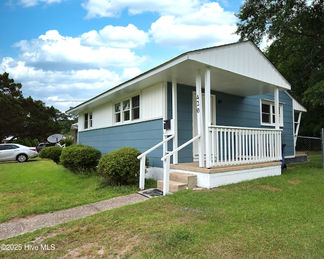420 New River Dr, Jacksonville, NC 28540 - view of front facade with a front lawn and covered porch