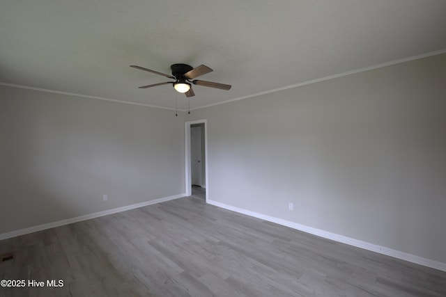 420 New River Dr, Jacksonville, NC 28540 - unfurnished room featuring ceiling fan, wood finished floors, baseboards, and ornamental molding