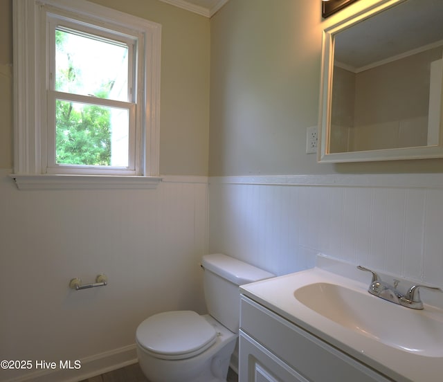 420 New River Dr, Jacksonville, NC 28540 - half bath with toilet, a wainscoted wall, vanity, ornamental molding, and a decorative wall