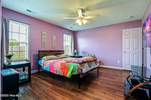 229 Red Carnation Dr, Holly Ridge, NC 28445 - bedroom featuring baseboards, wood finished floors, a textured ceiling, and ceiling fan