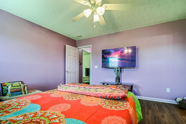 229 Red Carnation Dr, Holly Ridge, NC 28445 - bedroom featuring wood finished floors, a textured ceiling, baseboards, and ceiling fan