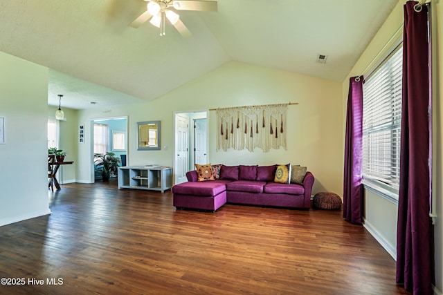 229 Red Carnation Dr, Holly Ridge, NC 28445 - living room featuring a ceiling fan, lofted ceiling, dark wood-style floors, healthy amount of natural light, and baseboards