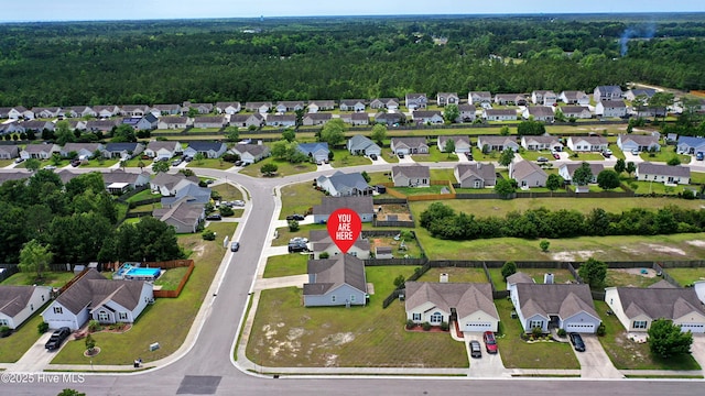 229 Red Carnation Dr, Holly Ridge, NC 28445 - aerial overview of property's location featuring nearby suburban area and a heavily wooded area