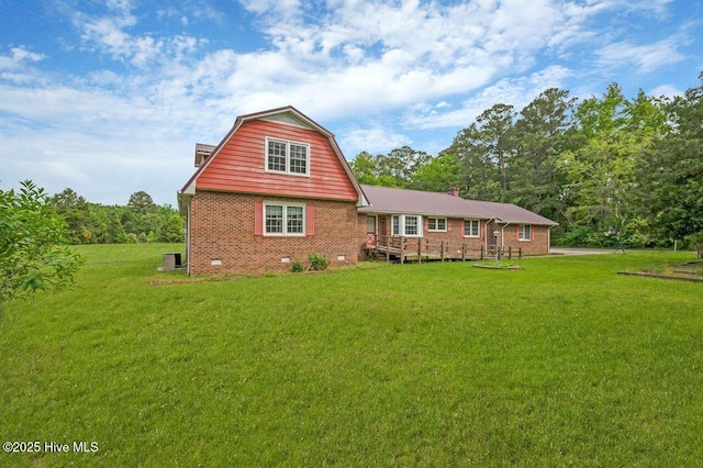 71 Hummingbird Ln, Washington, NC 27889 - back of property featuring brick siding, crawl space, a yard, and a gambrel roof