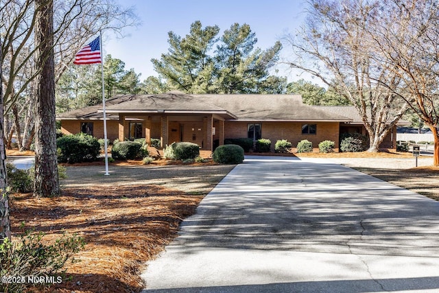 30080 Loblolly Ct, Wagram, NC 28396 - ranch-style house featuring concrete driveway and brick siding