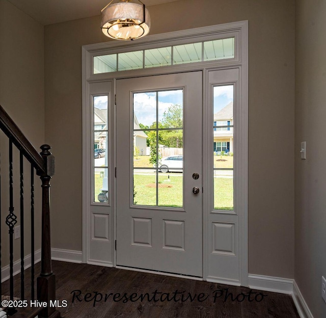 30080 Loblolly Ct, Wagram, NC 28396 - foyer entrance featuring dark wood finished floors and stairway