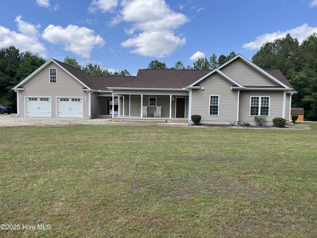 2483 Mcneill Hobbs Rd, Bunnlevel, NC 28323 - view of front facade with a porch, a front lawn, an attached garage, and driveway