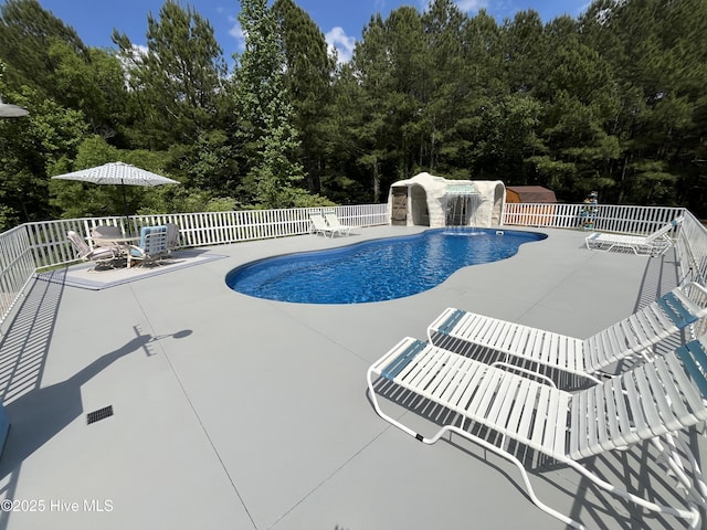 2483 Mcneill Hobbs Rd, Bunnlevel, NC 28323 - view of swimming pool with a patio area, fence, and a wooded view