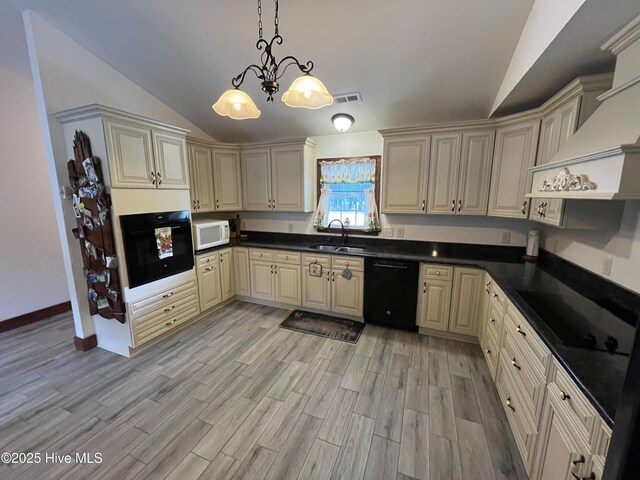 2483 Mcneill Hobbs Rd, Bunnlevel, NC 28323 - kitchen with black appliances, a sink, vaulted ceiling, light wood-style floors, and dark countertops