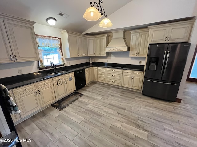 2483 Mcneill Hobbs Rd, Bunnlevel, NC 28323 - kitchen featuring custom exhaust hood, black appliances, lofted ceiling, cream cabinets, and a sink