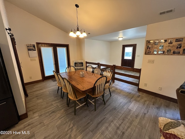 2483 Mcneill Hobbs Rd, Bunnlevel, NC 28323 - dining room with heating unit, dark wood finished floors, baseboards, and vaulted ceiling