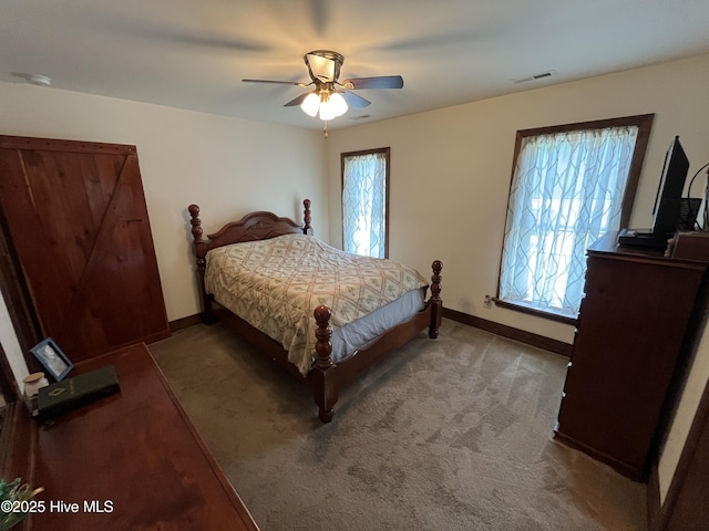 2483 Mcneill Hobbs Rd, Bunnlevel, NC 28323 - carpeted bedroom with baseboards and a ceiling fan