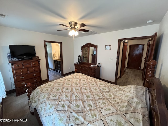 2483 Mcneill Hobbs Rd, Bunnlevel, NC 28323 - bedroom with baseboards, a ceiling fan, and ensuite bathroom