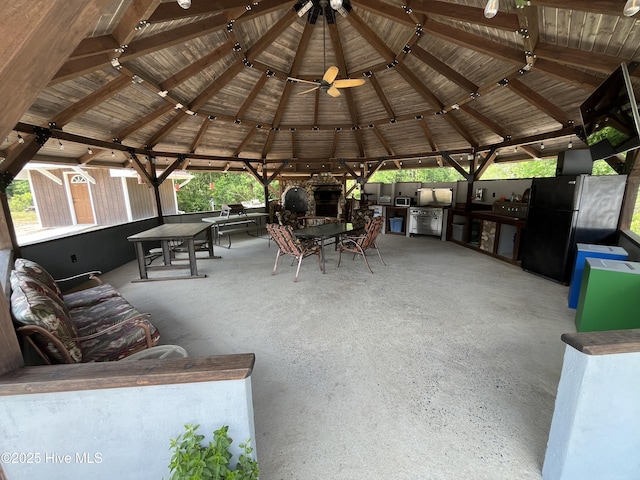 2483 Mcneill Hobbs Rd, Bunnlevel, NC 28323 - view of patio featuring a gazebo, exterior kitchen, a shed, outdoor dining area, and an outbuilding
