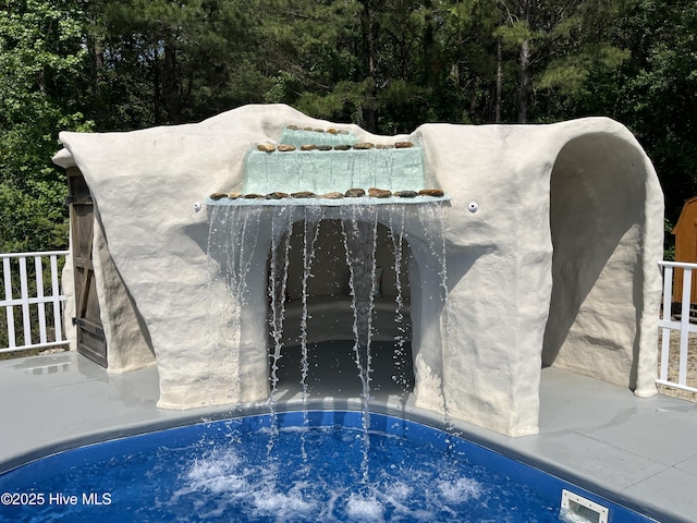 2483 Mcneill Hobbs Rd, Bunnlevel, NC 28323 - view of pool featuring a hot tub and a wooded view