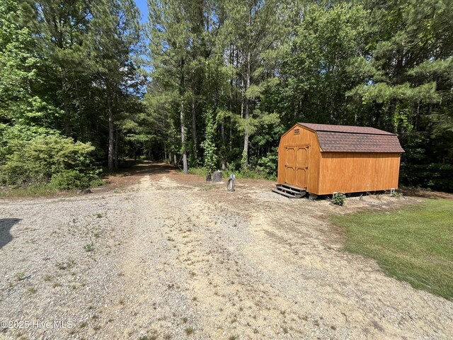 2483 Mcneill Hobbs Rd, Bunnlevel, NC 28323 - view of dirt / gravel road featuring a view of trees