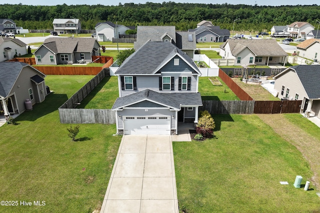 1232 Teakwood Dr, Greenville, NC 27834 - view of front of property featuring a residential view, concrete driveway, a shingled roof, and a fenced backyard