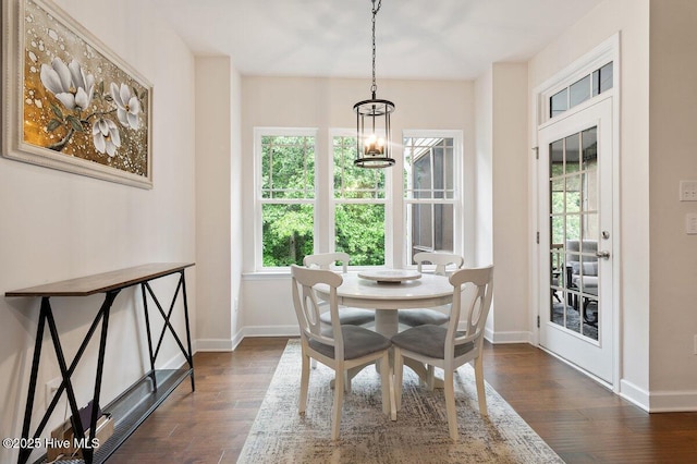 270 Wembley Dr, Clayton, NC 27527 - dining space with dark wood finished floors, baseboards, and a chandelier