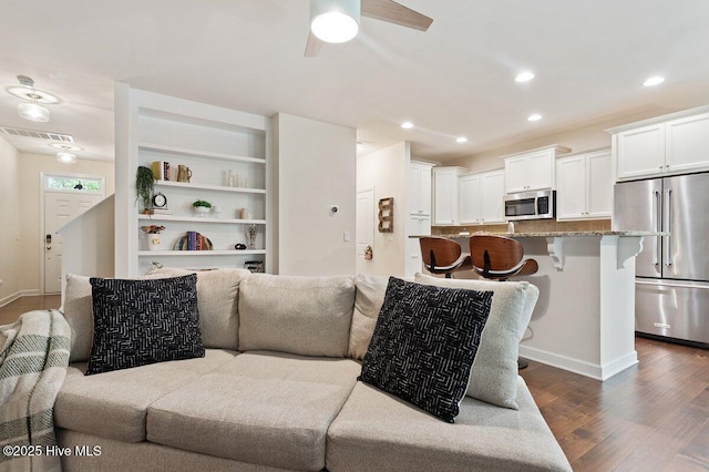 270 Wembley Dr, Clayton, NC 27527 - living room featuring dark wood-style floors, a ceiling fan, recessed lighting, and baseboards