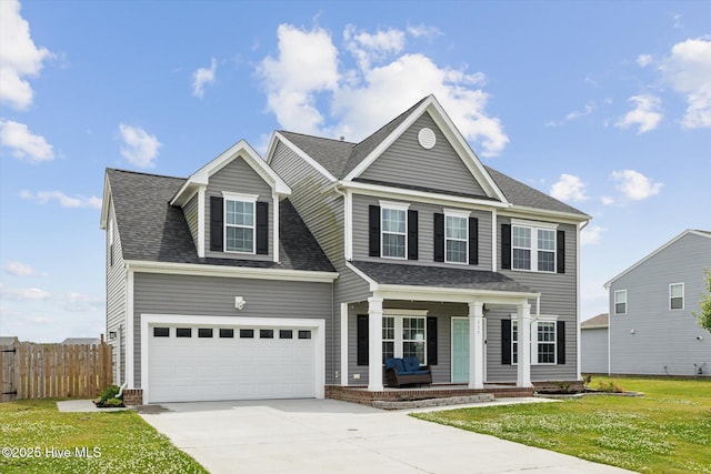 137 Gander Dr, Moyock, NC 27958 - traditional-style house featuring a porch, driveway, and roof with shingles