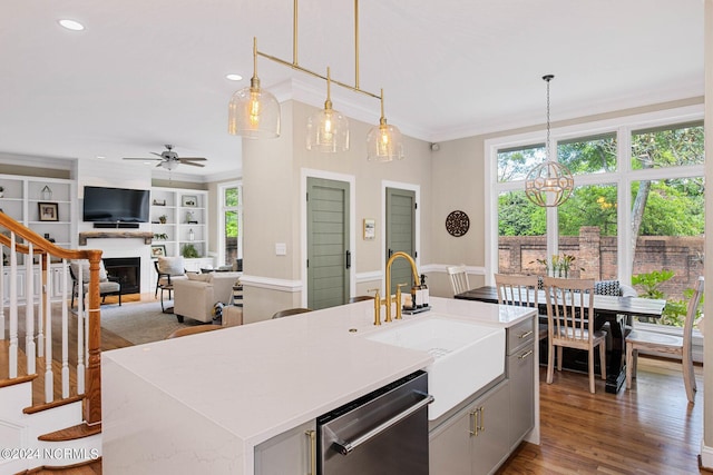 6920 Runningbrook Ter, Wilmington, NC 28411 - kitchen featuring ornamental molding, stainless steel dishwasher, a fireplace, a sink, and recessed lighting