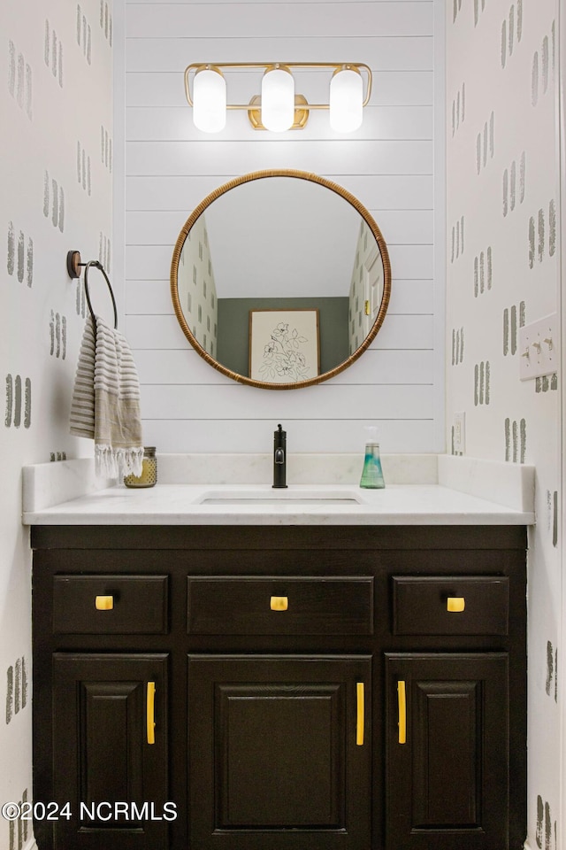 6920 Runningbrook Ter, Wilmington, NC 28411 - bathroom with vanity and wood walls